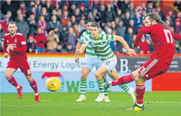  ??  ?? Stevie May equalises for Aberdeen in the seven-goal Boxing Day thriller with Celtic at Pittodrie as the Dons wind up a hectic December.