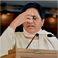  ??  ?? GETTING THE BLUES Mayawati interacts with the media in Lucknow on results day