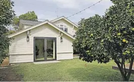  ?? Photograph­s by ?? THE ADU in back of this historic Culver City Craftsman adds to the property a sound studio, a guest bedroom and a family room that opens to the yard. A loft offers overflow space for guests.