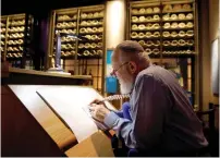  ?? (Kevin Lamarque/Reuters) ?? RABBI ELIEZER ADAM works on the Sefer Torah at Washington’s Museum of the Bible last week.