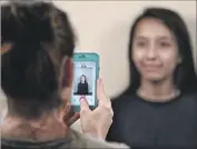  ?? Robert Gauthier Los Angeles Times ?? MAYRA Hernandez, 19, poses for a passport photo as she completes the DACA renewal process Saturday.