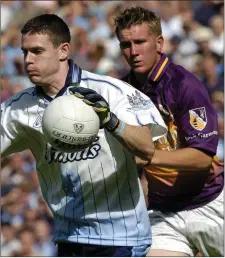  ??  ?? P.J. Banville in pursuit of Dublin netminder Stephen Cluxton.