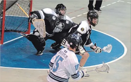  ?? BERND FRANKE THE ST. CATHARINES STANDARD ?? Orangevill­e goaltender Rylan Hartley, shown guarding the net against St. Catharines forward Mario Caito (15) in Game 1, was a key contributo­r in the Northmen's five-game victory over the Athletics in the Ontario Junior A Lacrosse League semifinals.