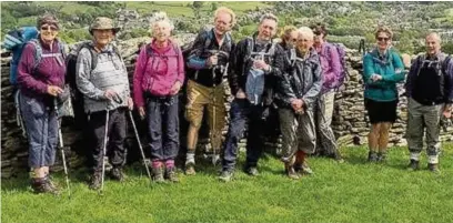  ??  ?? ●● East Cheshire Ramblers take a break to admire the view on their walk from Whaley Bridge