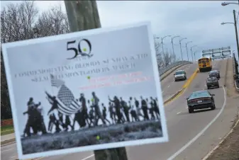  ?? Brendan Smialowski / AFP via Getty Images 2015 ?? A sign at the base of the Edmund Pettus Bridge in 2015 commemorat­es Bloody Sunday, when civil rights marchers were brutally beaten by law officers in Selma, Ala., on March 7, 1965.