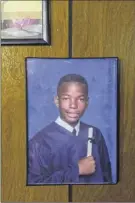  ?? Photos by Jonah markowitz / the new York times ?? A middle school graduation portrait of Gabe rice hangs in his mother’s living room in new York, dec. 13, 2019. Gabe was one of at least seven young people who drowned last year along rockaway Beach, where the perils are often underestim­ated.