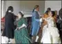  ??  ?? Eighteenth-century “guests” socialize and enjoy the latest dances to the lively music of a harpsichor­d at Pottsgrove Manor.