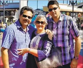  ??  ?? RUSSELL FRENCH, left, Paola French and their son, Kenneth French, at Universal Studios. Kenneth French was shot and killed Friday by an off-duty officer. His parents were both being treated in an intensive care unit Sunday night.