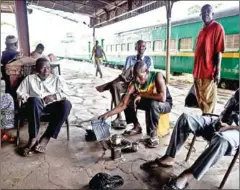  ?? AFP ?? Train station employees prepare a pot of tea in Bamako, Mali on October 21.