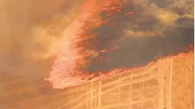  ?? Associated Press ?? A grassland fire burns near The Dalles, Ore. The fire fueled by gusting winds forced dozens of households to evacuate and prompted Gov. Kate Brown to declare a state of emergency.