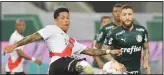  ??  ?? Enzo Perez of Argentina’s River Plate kicks the ball as Ze Rafael of Brazil’s Palmeiras looks on during a Copa Libertador­es semifinal second leg soccer match at the Allianz Parque stadium in Sao Paulo, Brazil, Tuesday. River Plate beat Palmeiras 2-0 but Palmeiras won 3-2 on aggregate. (AP)