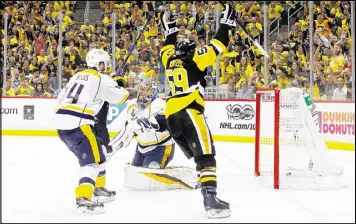  ?? KIRK IRWIN / GETTY IMAGES ?? The Penguins’ Jake Guentzel celebrates his go-ahead goal against Predators goalie Pekka Rinne with 3:17 left in Game 1 of the Stanley Cup Final.