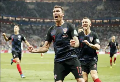  ?? FRANK AUGSTEIN — THE ASSOCIATED PRESS ?? Croatia’s Mario Mandzukic celebrates after scoring the goal that made Croatia the second smallest country to reach the World Cup final.