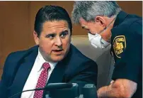  ?? Bob Owen / Staff photograph­er ?? City Manager Erik Walsh talks with Police Chief William Mcmanus during the council meeting.