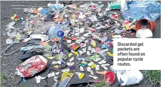  ??  ?? Discarded gel packets are often found on popular cycle routes.