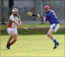  ??  ?? Kiltegan’s Michael Mangan tries to stop John Connors of St Patrick’s from clearing this ball in Joule Park Aughrim.