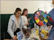  ?? ?? Butte County Office of Education employee Joselinne Pulido, left, and intern Taylor Cutler talk to students and give out informatio­n about the harmful effects of tobacco at the Take Down Tobacco event at the Paradise Junior High School cafeteria in Paradise.