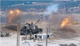  ?? AYAL MARGOLINC/JINIPIX ?? Israeli forces fire artillery from their position on the border with Lebanon after a barrage of rockets were fired Friday from Lebanon.