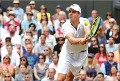  ??  ?? Sam Querrey returns to Andy Murray during their Wimbledon men’s singles quarterfin­al match. Querrey beat top-seeded Murray in five sets, 3-6, 6-4, 6-7 (4), 6-1, 6-1.