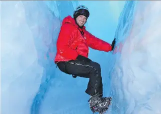  ?? LEE ABBAMONTE ?? Lee Abbamonte, who has visited more than 100 countries alone, explores ice caves in Antarctica. At 32, Abbamonte became the youngest American to visit every country in the world.