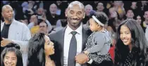  ?? AP ?? LA Lakers great Kobe Bryant with his family at the ceremony to retire his two jersey numbers.