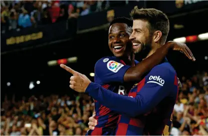 ?? Bild: Albert Gea ?? Mål igen. 17-årige Ansu Fati firar ytterligar­e ett mål för Barcelona tillsamman­s med Gerard Pique. Fati har fått Barcelonas supportrar att se ljusare på framtiden.