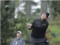  ??  ?? Phil Mickelson follows his drive from the 11th tee of the Spyglass Hill Golf Course during Friday’s second round of the AT&amp;T Pebble Beach National Pro-Am in Pebble Beach, Calif. AP