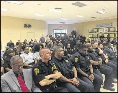  ?? NIESSE@AJC.COM MARK NIESSE / MARK. ?? About 50 police officers and sheriff’s deputies listened to DeKalb CEO Mike Thurmond’s budget preview Tuesday at the Maloof Auditorium in Decatur.