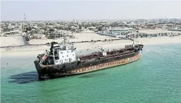  ?? /Reuters ?? Heavy going: An oil tanker run aground. A picture taken with a drone shows an aged oil tanker named MT Iba in Umm Al Quwain, United Arab Emirates. Across the whole industry 61 accidents or near accidents were recorded in 2021.