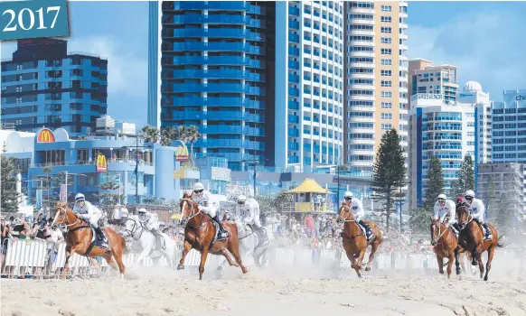  ?? Picture: TIM MARSDEN ?? The Magic Millions Barrier Draw includes horses galloping down Surfers Paradise beach.