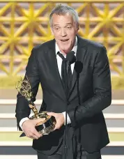  ?? KEVIN WINTER/GETTY IMAGES ?? Montreal’s Jean-Marc Vallée accepts the Emmy for outstandin­g directing for a limited series, movie, or dramatic special for Big Little Lies.