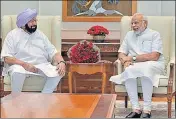  ?? PTI ?? Prime Minister Narendra Modi with Punjab chief minister Captain Amarinder Singh in New Delhi on Monday.