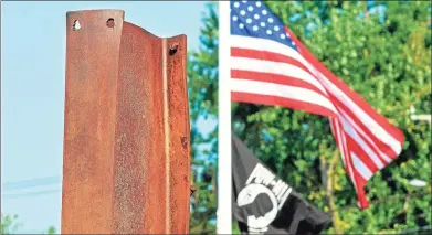  ?? Hearst Connecticu­t Media file photo ?? The American flag waves behind the 8-foot beam from the North Tower of the World Trade Center, the centerpiec­e of the South District Fire Department’s 9/11 Remembranc­e and Memorial Garden in Middletown. The city will hold two observance­s Saturday, the 20th anniversar­y of the 9/11 attacks.