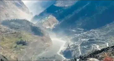  ?? AP ?? A surge of water, mud and debris flows downstream after a glacial breach in Chamoli district of Uttarakhan­d.