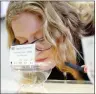  ?? AP PHOTO/MARCIO JOSE SANCHEZ ?? In this May 11 photo, Danielle Schumacher, CEO and cofounder of THC Staffing Group, a recruitmen­t firm that encourages a more diverse cannabis industry workforce, smells some cannabis flowers at Berkeley Patients Group in Berkeley, Calif.