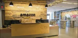  ?? DEBORAH CANNON / AMERICAN-STATESMAN ?? Amazon’s Austin offices are located near the Domain. The Seattle-based e-retail giant has expanded its local workforce this year to more than 900 people. It pledges 50,000 jobs to the winner of its second headquarte­rs site.