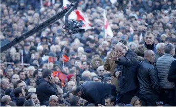  ??  ?? Opposition leader and former presidenti­al candidate Grigol Vashadze greets his supporters during a rally near the parliament building in Tbilisi, Georgia. — Reuters photo