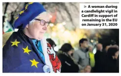  ??  ?? > A woman during a candleligh­t vigil in Cardiff in support of remaining in the EU on January 31, 2020