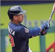  ?? AP-John Bazemore ?? Atlanta Braves’ Ehire Adrianza follows through on a two-run base hit in the fifth inning of a spring training baseball game against the Boston Red Sox in North Port, Fla., on March 20.