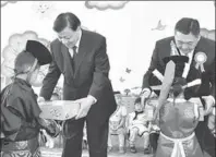  ?? GAO JIE / XINHUA ?? Liu Yunshan (left) and Miyegombo Enkhbold, chairman of the Mongolian People’s Party, attend a ceremony in Ulan Bator marking the opening of a kindergart­en built with funds from a Chinese foundation.