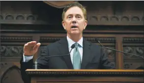  ?? Jessica Hill / Associated Press ?? Gov. Ned Lamont delivers his budget address at the State Capitol in Hartford on Feb. 20.