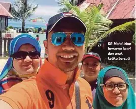  ??  ?? DR Mohd Izhar bersama isteri dan anak ketika bercuti.