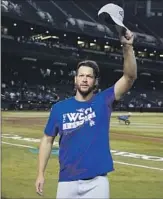  ?? Ross D. Franklin ?? CLAYTON KERSHAW, who pitched seven scoreless innings, acknowledg­es Dodgers fans.