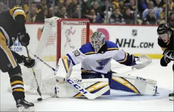  ??  ?? Blues goalie sensation Jordan Binnington denies Evgeni Malkin in the second period.