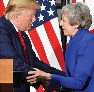  ??  ?? Awkward: Mr Trump greets our soon-not-to-be Prime Minister yesterday