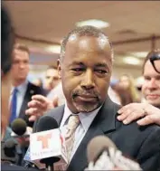  ?? Joe Raedle Getty Images ?? BEN CARSON, at a book-signing stop in Miami, counts among his supporters parents who homeschool their kids and use his books in their lessons.