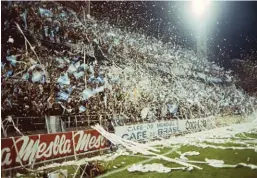  ??  ?? Argentina fans welcome their team onto the pitch with a deluge of confetti and toilet paper.