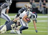  ?? Bill Feig Associated Press ?? RAMS tight end Johnny Mundt works for yards.