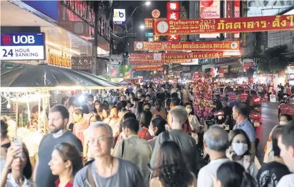  ?? WICHAN CHAROENKIA­TPAKUL ?? The atmosphere at Yaowarat Road in Chinatown, Bangkok, as an influx of Asian visitors is expected for the Lunar New Year.