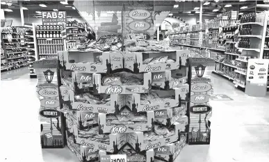  ?? ROBERT F. BUKATY/AP ?? Halloween candy is displayed at a store Wednesday in Freeport, Maine. Earlier Halloween displays likely helped boost sales.